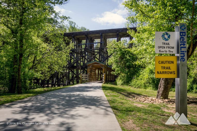 Follow the Northside BeltLine Trail at Tanyard Creek Park in Atlanta under a towering historic train trestle